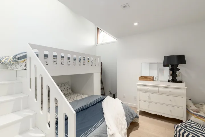 Bedroom featuring wood finished floors and baseboards