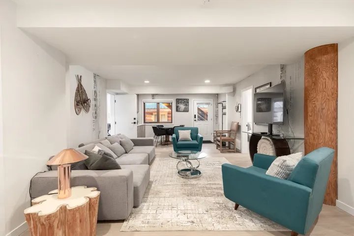 Living area featuring wood finished floors and recessed lighting