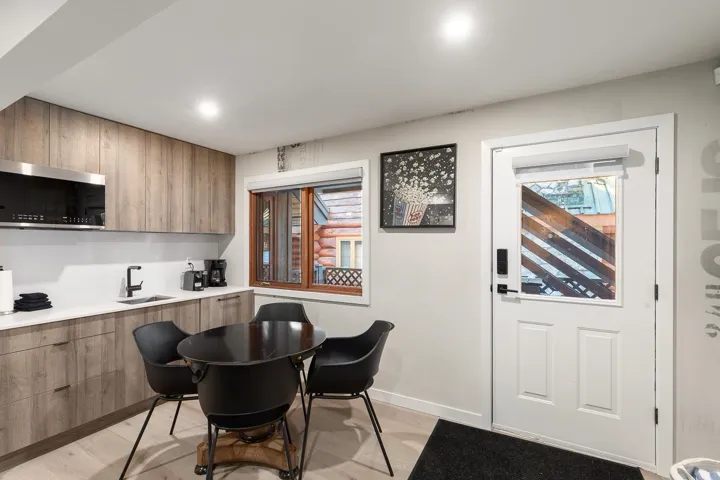 Dining room with light wood-type flooring and baseboards
