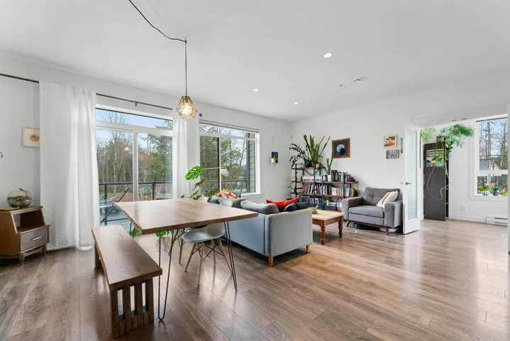 Dining space featuring recessed lighting, a baseboard radiator, and wood finished floors