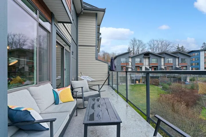 Balcony featuring an outdoor living space and a residential view