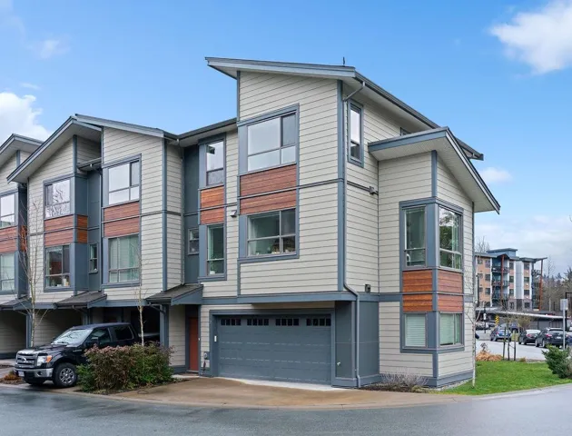 Multi unit property featuring an attached garage