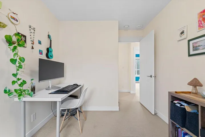 Office space with carpet flooring and baseboards
