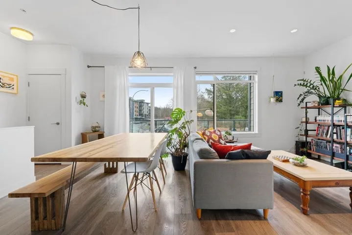 Dining room with plenty of natural light, wood finished floors, and recessed lighting