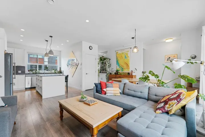 Living room featuring hardwood / wood-style floors and recessed lighting