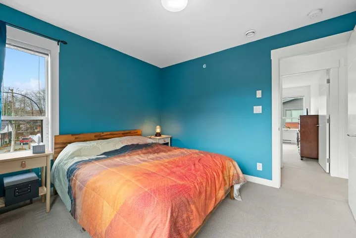 Carpeted bedroom featuring baseboards