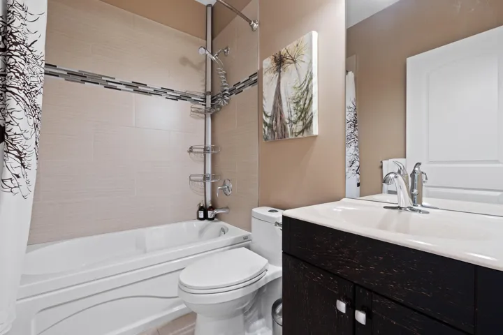 Full bathroom with vanity.
