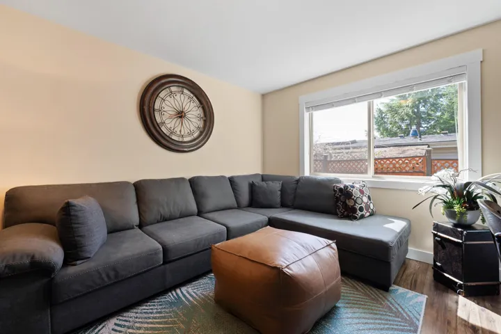 Bright open Living area featuring wood finished floors