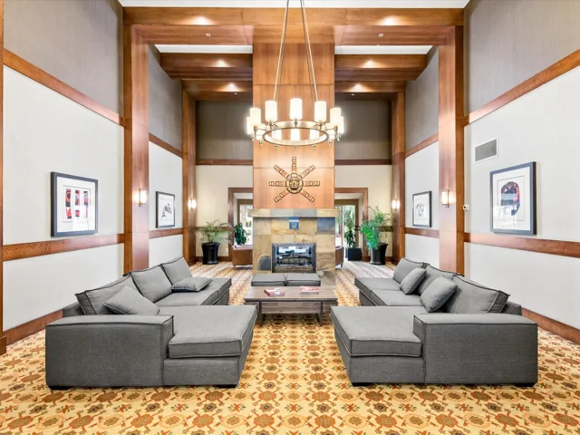 Building lobby with beamed ceiling and a high ceiling