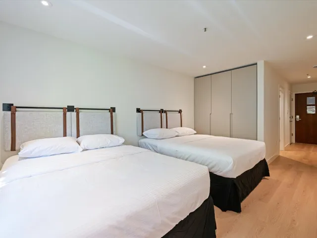 Bedroom with recessed lighting, light wood finished floors, and a closet