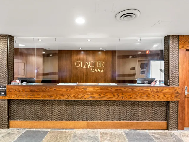 Welcome area with wooden walls and recessed lighting