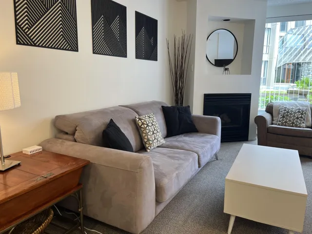 Living area featuring an integrated fireplace with a recessed niche