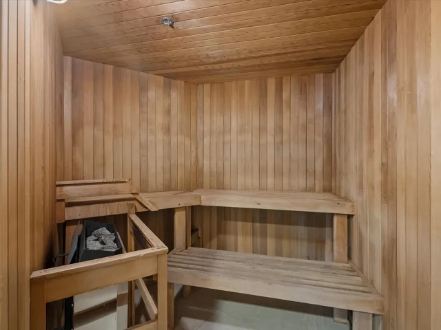 Relaxing sauna / steam room with wood ceiling