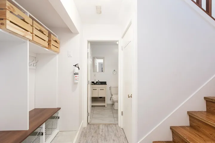 Mudroom featuring visible vents and a sink