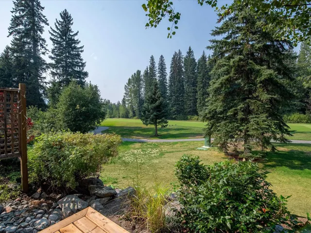 View of home's community with a yard