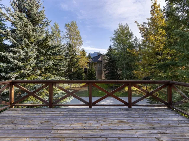 Deck featuring view of wooded area