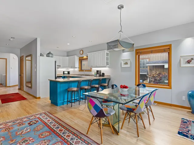 Dining space featuring light wood finished floors and recessed lighting