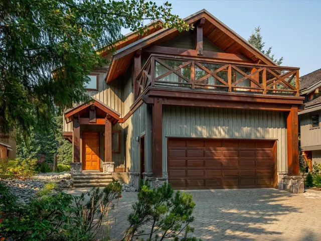 View of front of house featuring decorative driveway