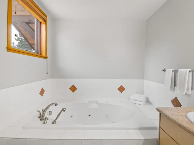 Bathroom with a whirlpool tub and vanity
