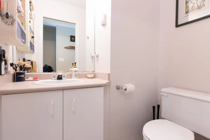 Half bathroom with toilet and vanity