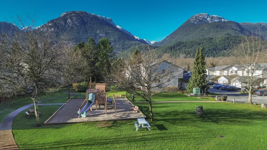 Exterior space featuring a mountain view and a yard