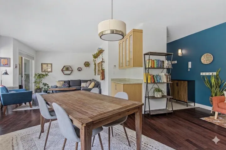 Open-concept living area with dark wood-finish flooring