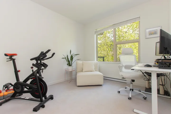 Office with baseboards, carpet floors, and baseboard heating