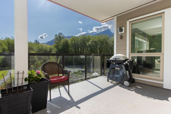 Balcony featuring grilling area and a mountain view