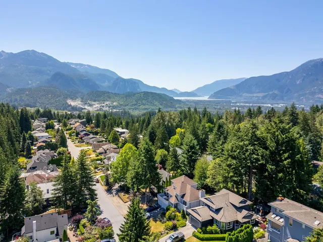 Aerial view of residential area featuring a mountainous background
