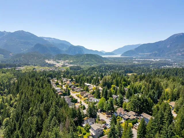 Drone / aerial view of mountains and a heavily wooded area