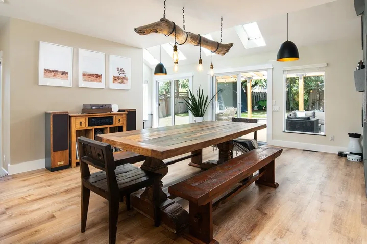 Dining space featuring a skylight, healthy amount of natural light, and light wood-style floors