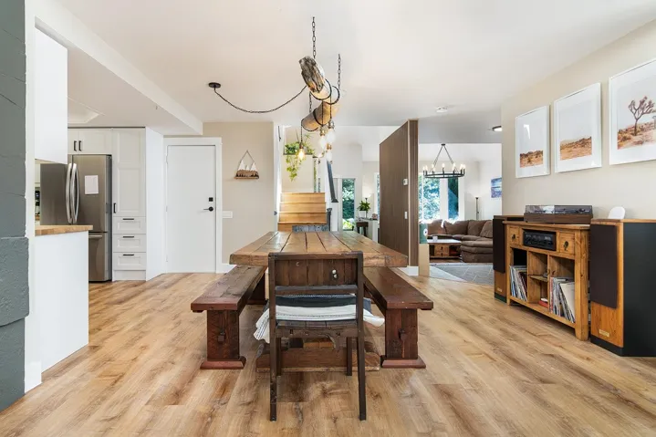 Dining space featuring light wood-style floors and a chandelier