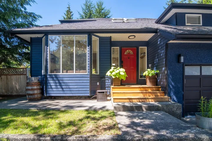 View of front of home featuring roof with shingles