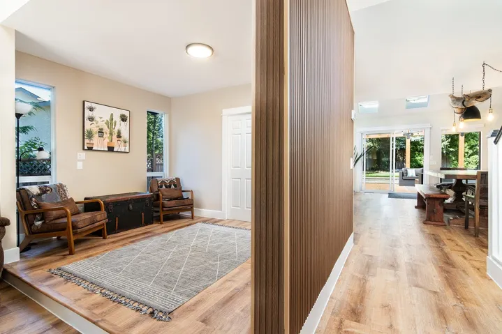 Hallway featuring light wood-type flooring and plenty of natural light