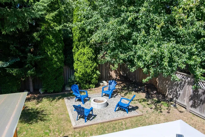 View of yard featuring an outdoor fire pit and a patio