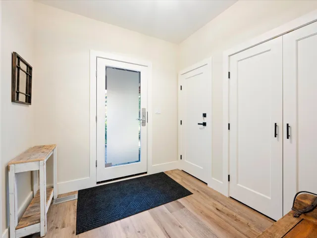 Foyer entrance featuring light wood finished floors