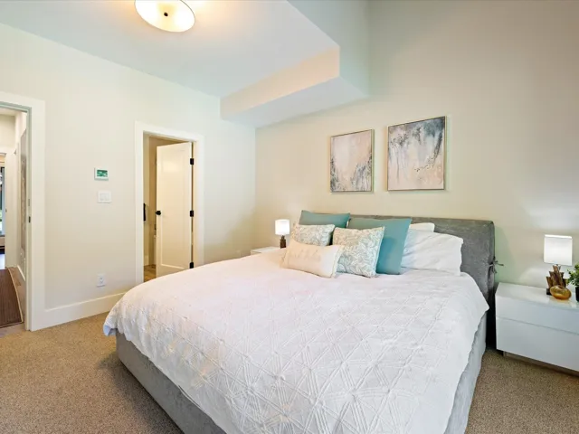 Carpeted bedroom featuring baseboards