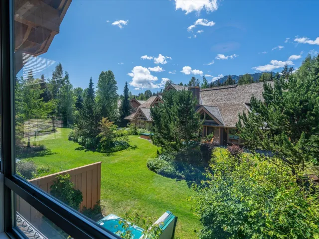 View of green lawn with a balcony
