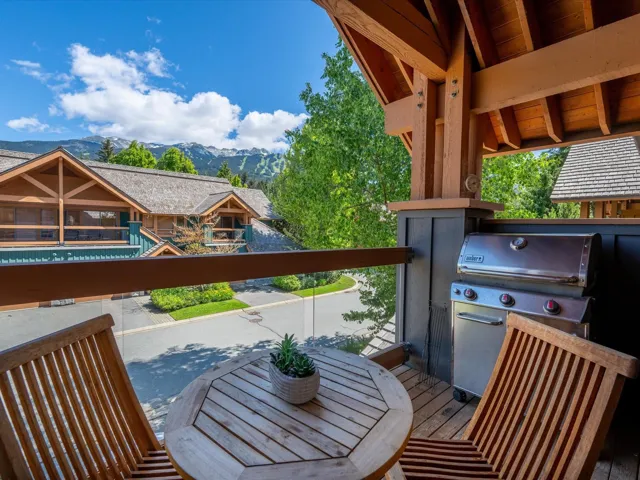 View of patio with a mountain view and an outdoor kitchen