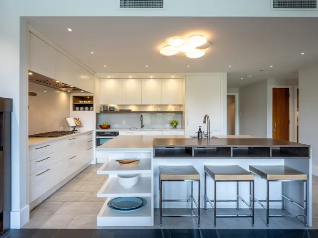 Kitchen featuring open shelves, a large island with sink, modern cabinets, white cabinetry, and recessed lighting
