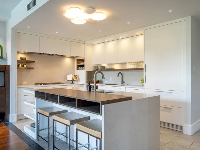 Kitchen featuring open shelves, light wood-style floors, modern cabinets, dark stone countertops, and recessed lighting