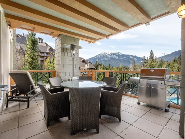 View of patio / terrace with a mountain view, grilling area, and outdoor dining area