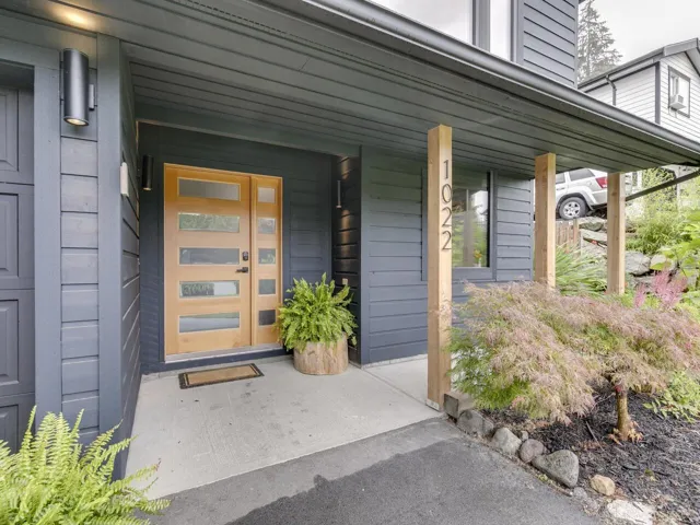 View of exterior entry with covered porch