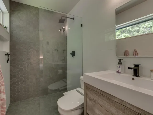 Bathroom featuring vanity and a walk in shower