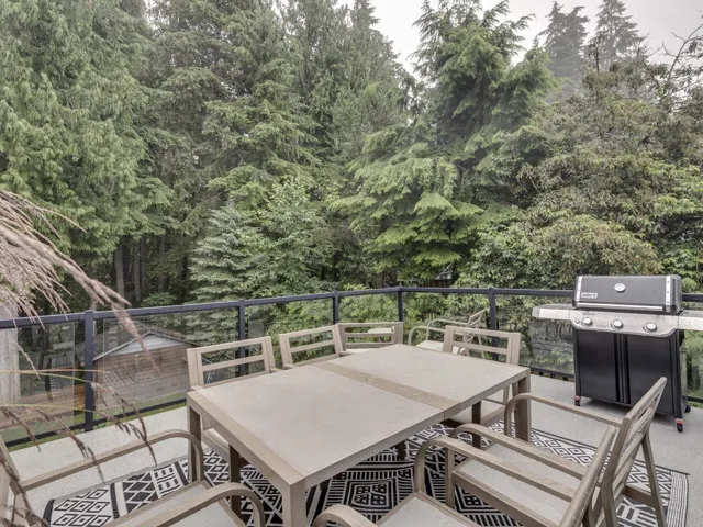 Deck featuring area for grilling and outdoor dining space