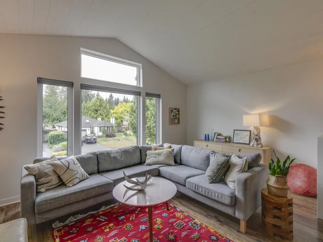 Living area featuring wood finished floors and high vaulted ceiling