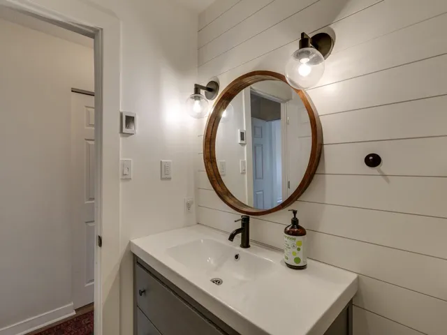 Bathroom with vanity and baseboards