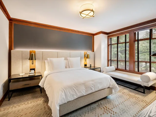 Bedroom with crown molding and baseboards