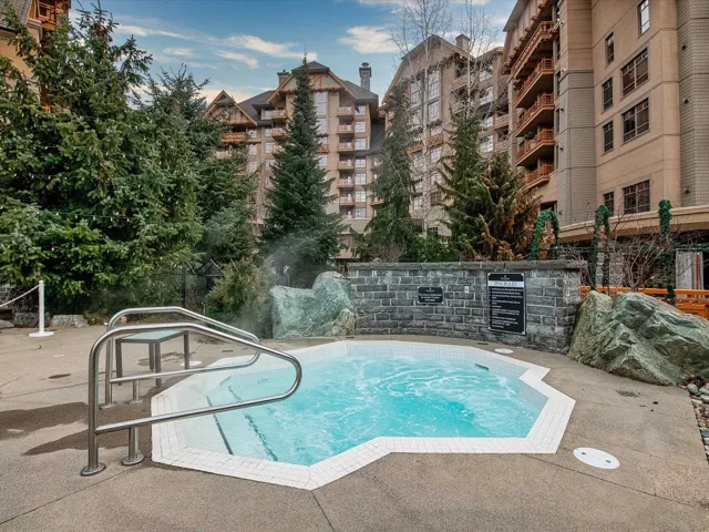 View of pool featuring a community hot tub