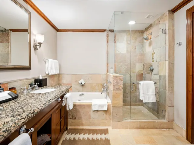 Full bath with visible vents, a bath, crown molding, vanity, and a stall shower